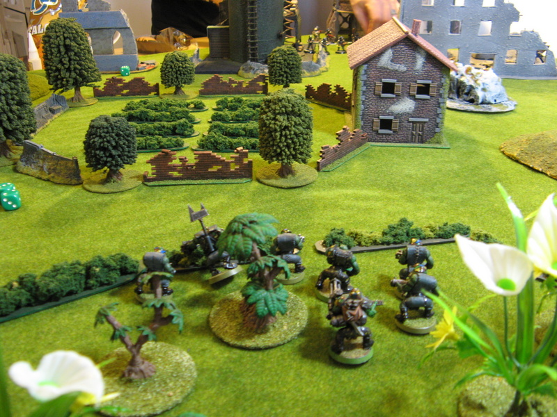 Initial Deployment.  The orks move forward through the cover of the woods whilst the guard cross the ruins opposite